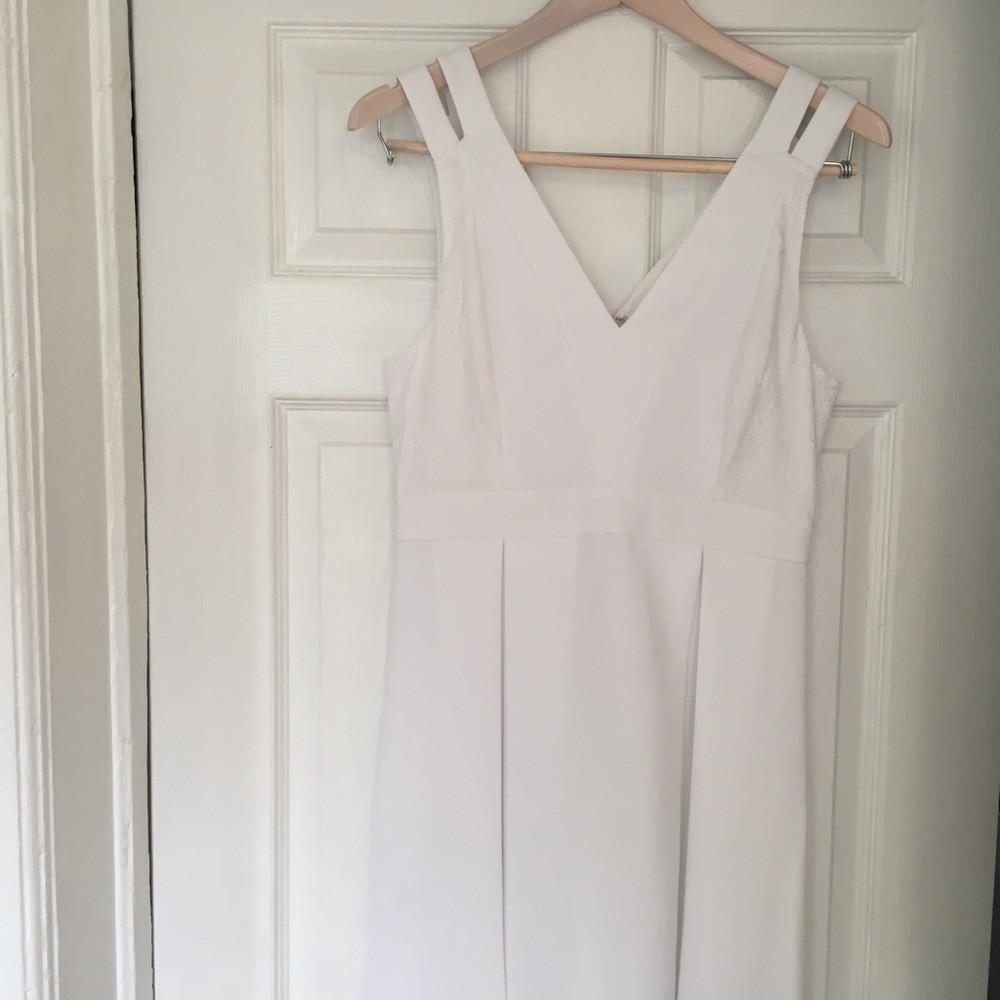 BCBG dress with cutouts and white lace panels.